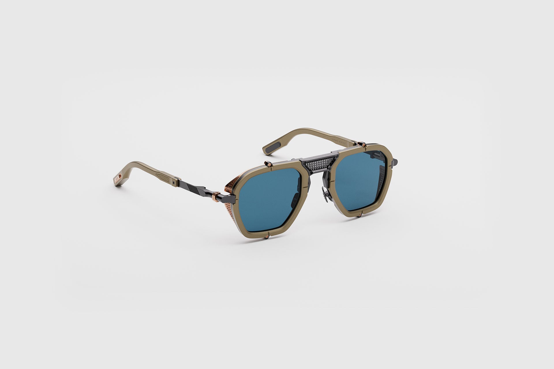 Movitra Nomad 02 sunglasses in C2 Desert Sand, three-quarter view showing titanium blinkers
