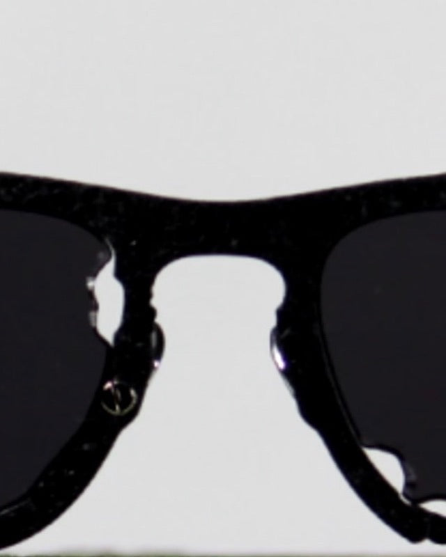Titanium Museum sunglasses in textured black titanium, close view of the bridge