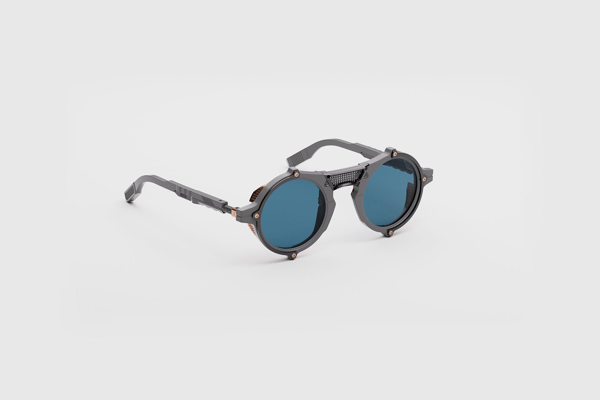 Movitra Nomad 01 sunglasses in C3 Solid Grey (Matte), three-quarter view showing titanium blinkers